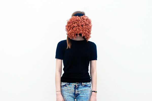 A woman whose face is obscured by a giant puff.